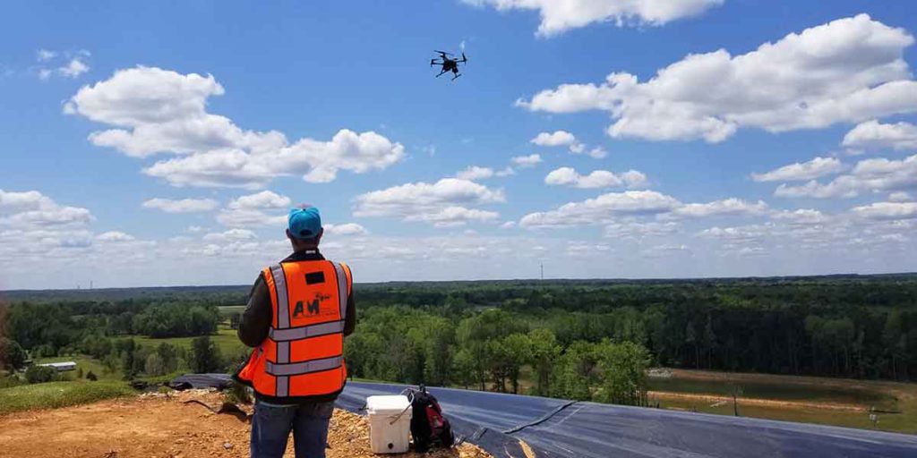 AIM crew watching a drone in the sky